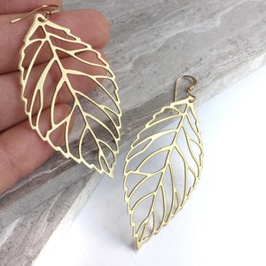 Big Brass Leaf cut out Earrings, in hand