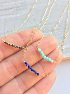 Janie Necklace: pyrite, lapis, amazonite on gold chain, in hand