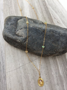 Opal Charm Necklace on rock